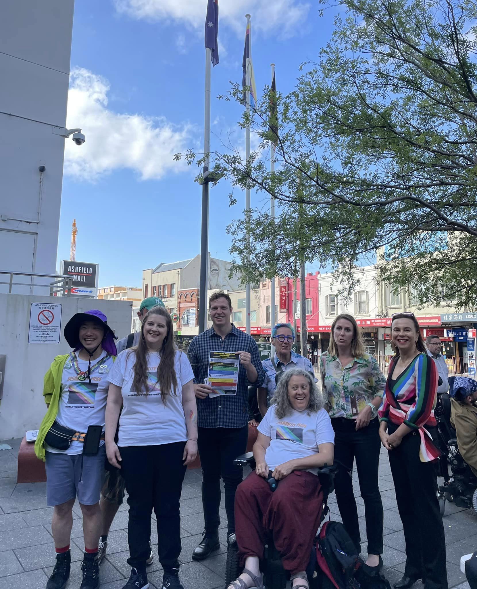 Group photo, outdoors, Jane is in her wheelchair